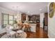 Stylish kitchen with an island, granite countertops, dark wood cabinetry, and stainless steel appliances at 5761 Sawgrass Cir, Lithonia, GA 30038
