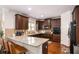 Modern kitchen boasting granite counters, dark cabinets, and stainless steel appliances at 5761 Sawgrass Cir, Lithonia, GA 30038