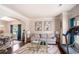 Cozy living space with hardwood floors, a plush sofa, and bright natural light at 5761 Sawgrass Cir, Lithonia, GA 30038