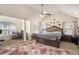 Spacious main bedroom featuring a vaulted ceiling, a king bed, and a separate office area at 5761 Sawgrass Cir, Lithonia, GA 30038