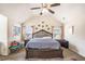 Comfortable main bedroom with vaulted ceiling, a king bed, side tables, and a sitting bench at 5761 Sawgrass Cir, Lithonia, GA 30038
