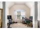 Office nook with computer, desk, chair, workout bike, and natural light streaming through the window at 5761 Sawgrass Cir, Lithonia, GA 30038