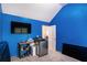 Laundry room with blue walls features a stainless steel washer and dryer and plenty of space at 5761 Sawgrass Cir, Lithonia, GA 30038