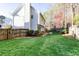 A large, well-maintained backyard with green grass and a privacy fence at 2516 Woolwich Nw Ct, Acworth, GA 30101