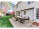 Outdoor living space features a patio with outdoor seating and scenic backyard views at 2516 Woolwich Nw Ct, Acworth, GA 30101