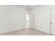 This bright bedroom has neutral carpet, a ceiling fan, and a door that opens to the bathroom at 2516 Woolwich Nw Ct, Acworth, GA 30101