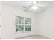 Bright bedroom with neutral carpet and large windows overlooking the wooded backyard at 2516 Woolwich Nw Ct, Acworth, GA 30101