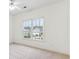 Bedroom with bright window and neutral carpeting at 2516 Woolwich Nw Ct, Acworth, GA 30101
