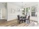 Inviting dining room with bright windows, modern lighting, and seating for four at 2516 Woolwich Nw Ct, Acworth, GA 30101
