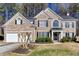 Charming brick two-story home with well-manicured lawn and attached two car garage at 2516 Woolwich Nw Ct, Acworth, GA 30101