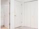 Hallway with multiple doors including closet and access to other rooms at 2516 Woolwich Nw Ct, Acworth, GA 30101