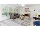 Bright living room with comfortable seating and a decorative fireplace at 2516 Woolwich Nw Ct, Acworth, GA 30101