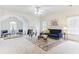 Spacious living room with high ceilings, plush seating, and natural light at 2516 Woolwich Nw Ct, Acworth, GA 30101
