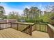Spacious backyard view from deck showcasing a large yard and pool area with a blue umbrella at 2520 Robin Hood Ne Pl, Marietta, GA 30068
