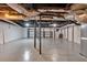 Large unfinished basement with painted floor and ceiling, providing a blank canvas for future development at 2520 Robin Hood Ne Pl, Marietta, GA 30068
