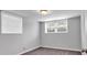 Bedroom with two windows and neutral carpet and paint at 2520 Robin Hood Ne Pl, Marietta, GA 30068