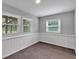 Bedroom with chair rail, two windows, and neutral carpet and walls at 2520 Robin Hood Ne Pl, Marietta, GA 30068