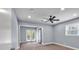 Spacious bedroom featuring a ceiling fan, recessed lighting, and patio access at 2520 Robin Hood Ne Pl, Marietta, GA 30068