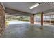 Covered carport with concrete flooring, brick column supports, and an open design at 2520 Robin Hood Ne Pl, Marietta, GA 30068