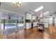 Modern kitchen flowing into a dining area with views of a backyard pool and patio through sliding glass doors at 2520 Robin Hood Ne Pl, Marietta, GA 30068