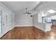 Bright living room with hardwood floors, ceiling fan, and ample natural light streaming through windows at 2520 Robin Hood Ne Pl, Marietta, GA 30068