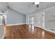 Hardwood floors accent the spacious living room, featuring a bay window, and natural light at 2520 Robin Hood Ne Pl, Marietta, GA 30068