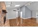 Bright living room with a vaulted ceiling, fireplace, hardwood floors, and neutral wall colors at 2520 Robin Hood Ne Pl, Marietta, GA 30068