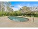 Inviting backyard pool with lounge chairs, umbrella, and lush landscaping for relaxing outdoor living at 2520 Robin Hood Ne Pl, Marietta, GA 30068