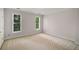A neutral-toned bedroom with plush carpet and bright windows at 978 Moores Club Ne, Atlanta, GA 30319