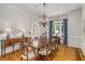 Elegant dining room featuring a large dining table, chandelier, and hardwood floors at 978 Moores Club Ne, Atlanta, GA 30319