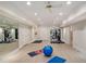 Home gym equipped with modern exercise machines, mirrors, and rubber flooring at 978 Moores Club Ne, Atlanta, GA 30319