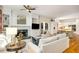 Inviting living room with fireplace, built-ins, and seamless flow into the kitchen, great for modern living at 978 Moores Club Ne, Atlanta, GA 30319