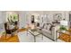 Spacious living room featuring hardwood floors, neutral furniture, and an open floor plan at 978 Moores Club Ne, Atlanta, GA 30319