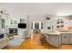 Bright living room featuring a fireplace, built-in shelving, and seamless connection to the eat-in kitchen with a large island at 978 Moores Club Ne, Atlanta, GA 30319