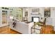 Cozy living room with hardwood floors, fireplace, built-in shelves, and French doors leading to outdoor space at 978 Moores Club Ne, Atlanta, GA 30319
