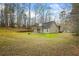 Home featuring a covered patio and a spacious backyard at 300 Lakeside Dr, Covington, GA 30016