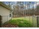 Home's chainlink fenced backyard at 300 Lakeside Dr, Covington, GA 30016