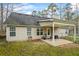 The home features a covered patio with space for seating at 300 Lakeside Dr, Covington, GA 30016