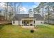 Home's covered patio with a spacious, flat backyard at 300 Lakeside Dr, Covington, GA 30016