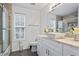 Bathroom featuring a vessel sink, glass shower, and modern fixtures at 300 Lakeside Dr, Covington, GA 30016