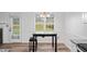 Bright dining area featuring a table, bench seating, and a view of the outdoors at 300 Lakeside Dr, Covington, GA 30016
