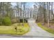 Charming ranch-style home with a two-car garage and a long concrete driveway at 300 Lakeside Dr, Covington, GA 30016