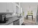 Bright kitchen with granite countertops, stainless steel appliances, and hardwood floors at 300 Lakeside Dr, Covington, GA 30016