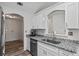 Kitchen with granite countertops, stainless steel appliances, and modern sink fixtures at 300 Lakeside Dr, Covington, GA 30016