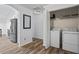 Convenient laundry room with washer, dryer, and ample storage space at 300 Lakeside Dr, Covington, GA 30016