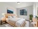 Staged bedroom with a queen bed, serene decor, and a large window at 31 Fox Creek Ct, Dallas, GA 30157