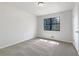 Light and airy bedroom with neutral carpet, window, and ample natural light at 31 Fox Creek Ct, Dallas, GA 30157