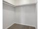 Walk in closet featuring carpet flooring and plenty of shelving at 31 Fox Creek Ct, Dallas, GA 30157