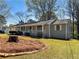 Well-maintained single story home showcasing front porch, neat landscaping, and cozy curb appeal at 31 Fox Creek Ct, Dallas, GA 30157