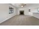 Spacious, airy living room with a stone fireplace, large window, and seamless transition to dining area at 31 Fox Creek Ct, Dallas, GA 30157